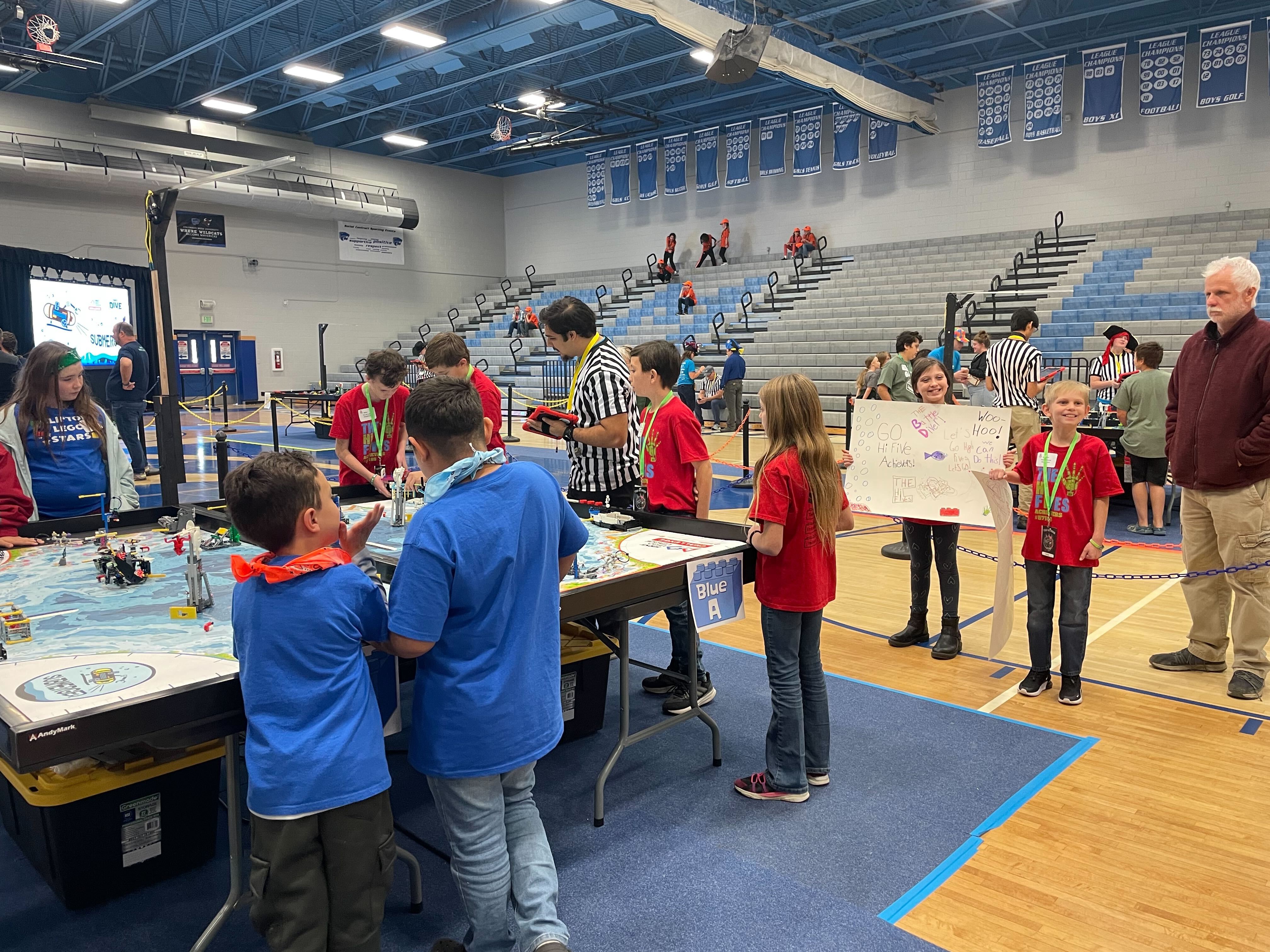 FLL Challenge kids working on their robot