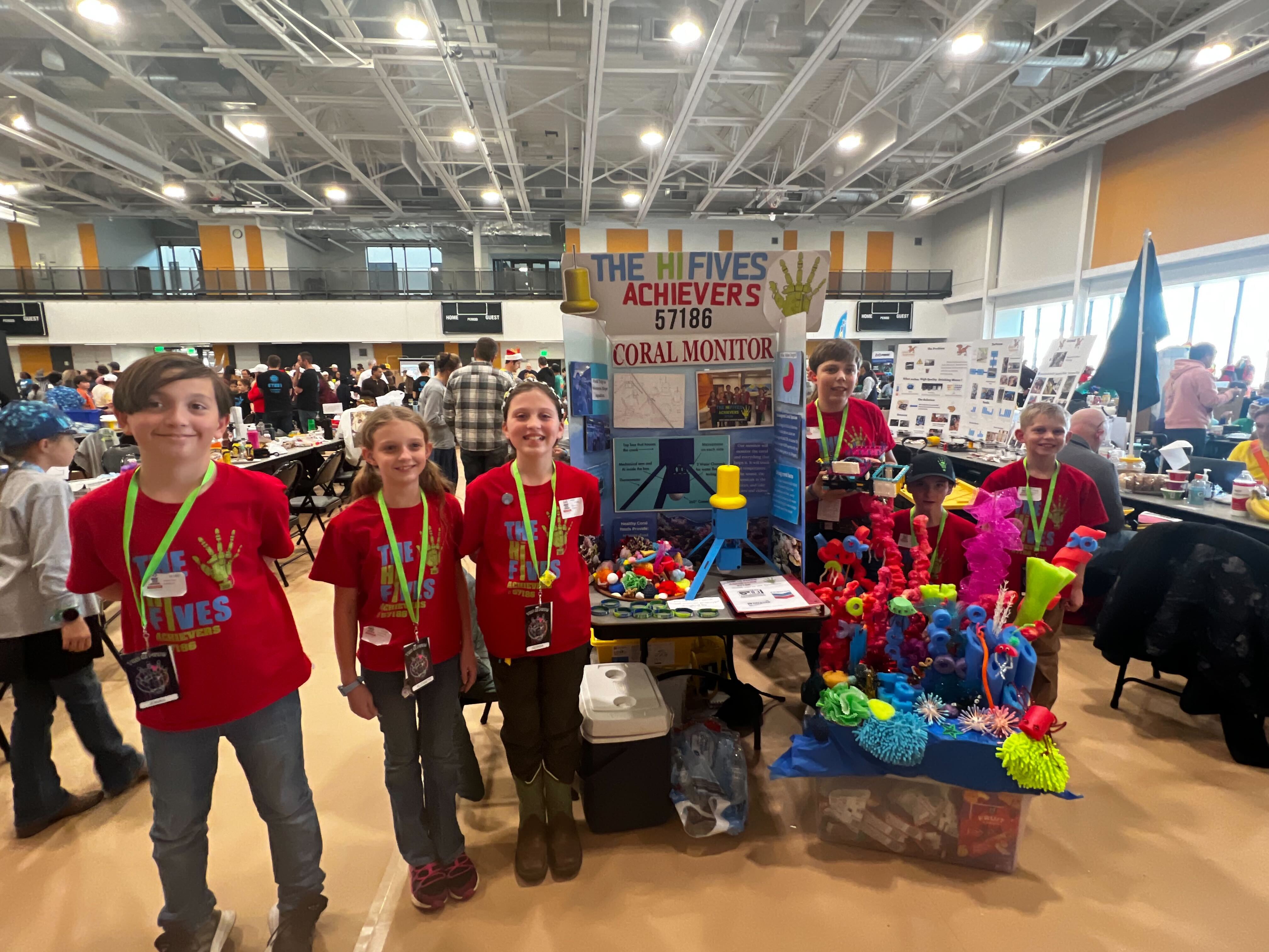 FLL Challenge showing off their Innovation Project at the state Championships